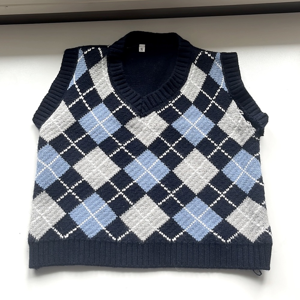 sweater vest size small with slit rip in sleeve